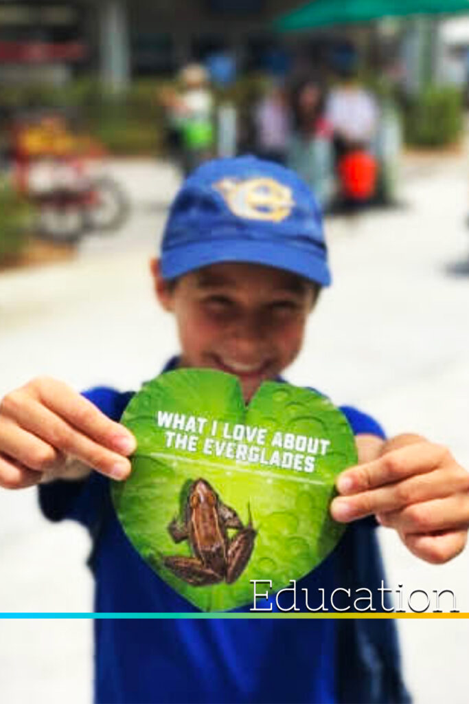 Young student holding Everglades Card